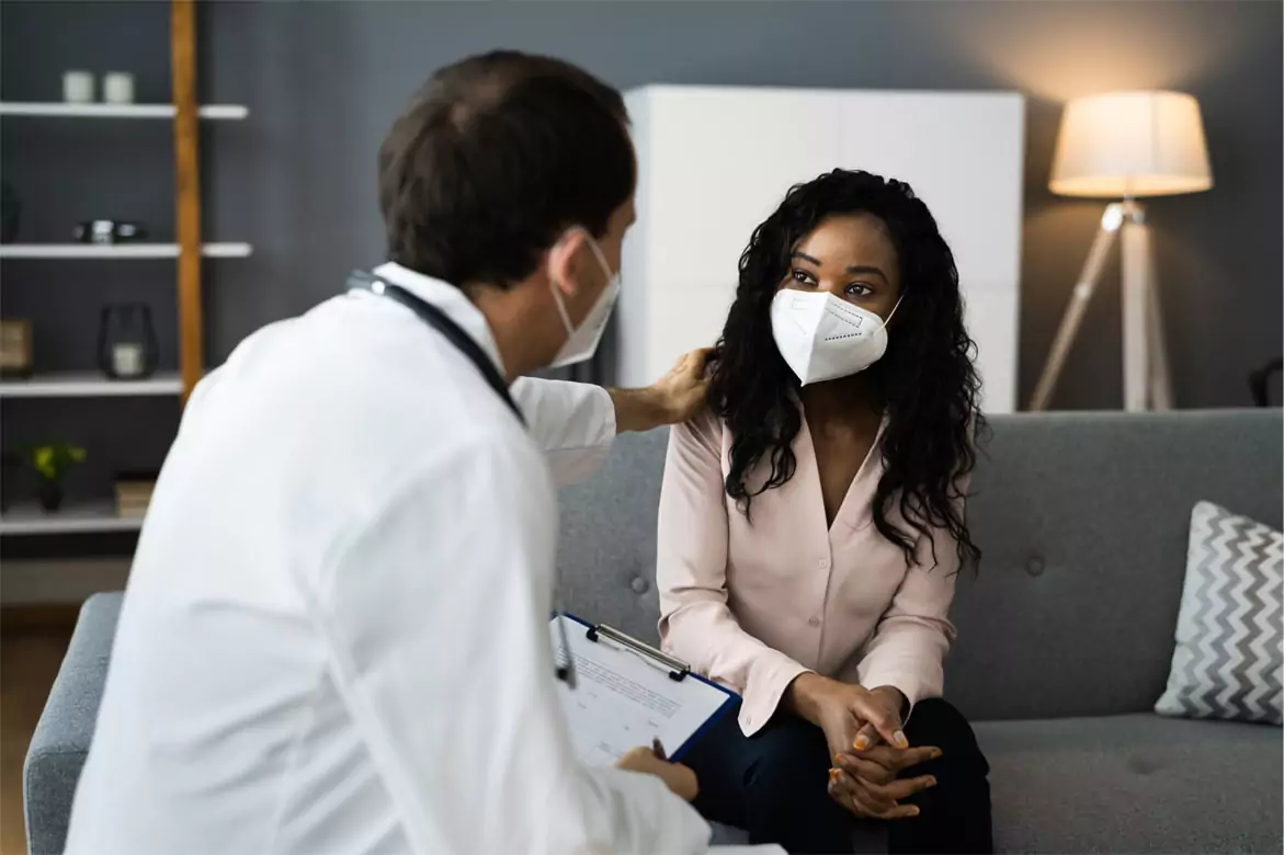 Image of doctor and patient having conversation.